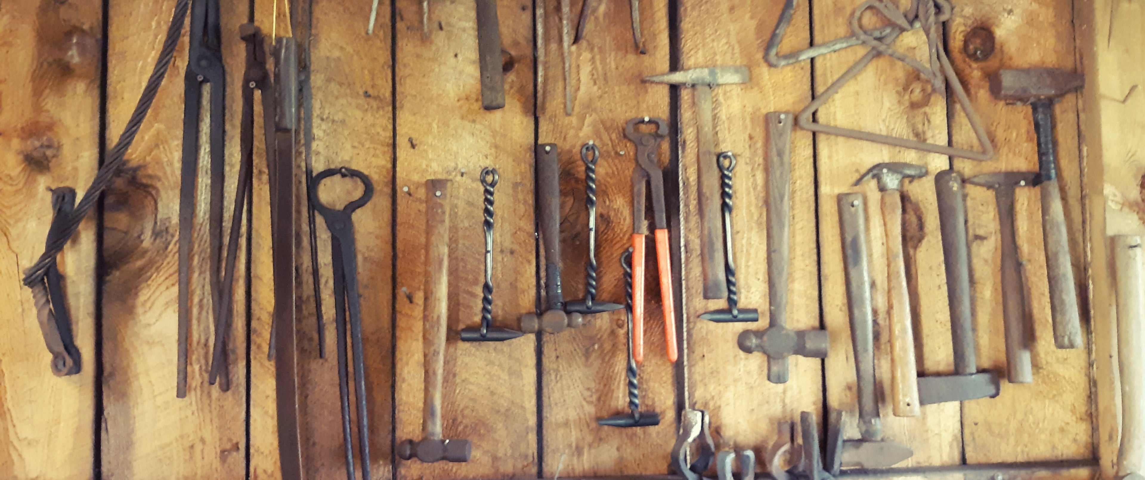 Tools used by our blacksmith in the forge.  Hammers, tongs and other tos are used to create hand forged metal work here on our family farm.