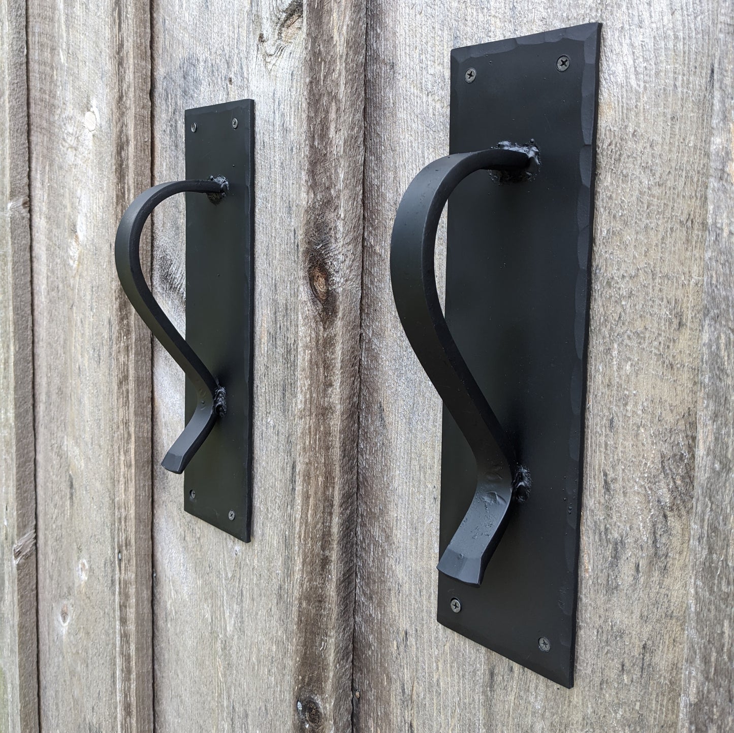 Large Gracefully Curved Blacksmith Made Door Pulls on Sturdy Backplate