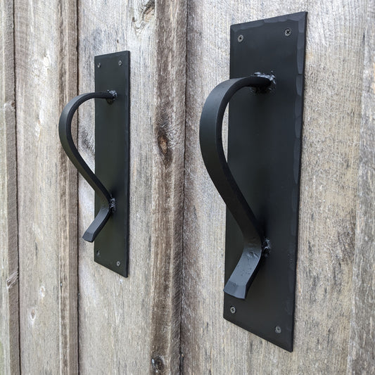 Large Gracefully Curved Blacksmith Made Door Pulls on Sturdy Backplate